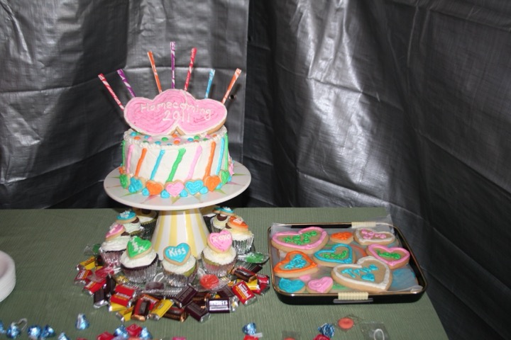 Colorful striped cake with heart cookies and cupcakes for Homecoming 2011
